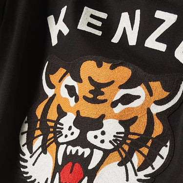 Black garment with a tiger logo and 'Kenzo Paris' text.